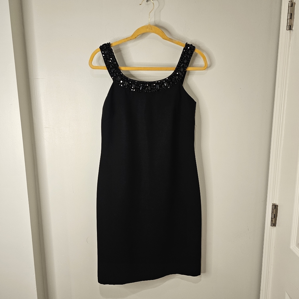 J S Boutique  women's black sleeveless cocktail dress with a beaded collar.